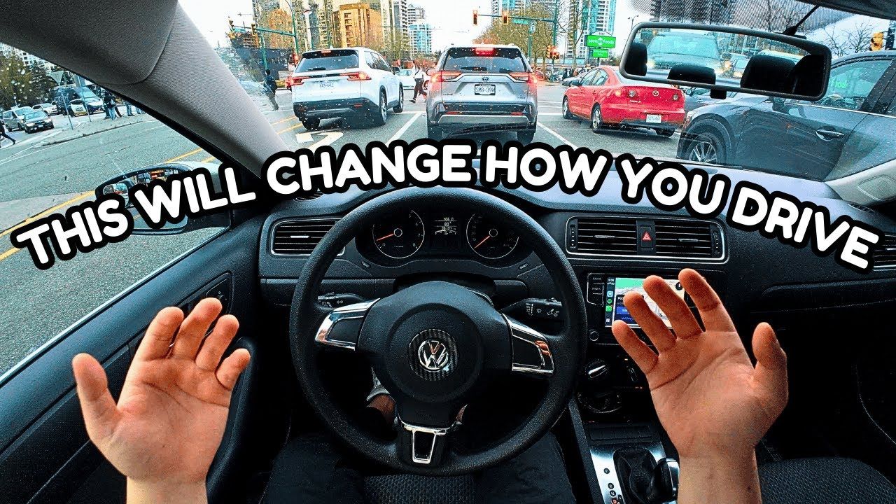 POV from a car driving through a busy city street with the Savvy Wheels host narrating